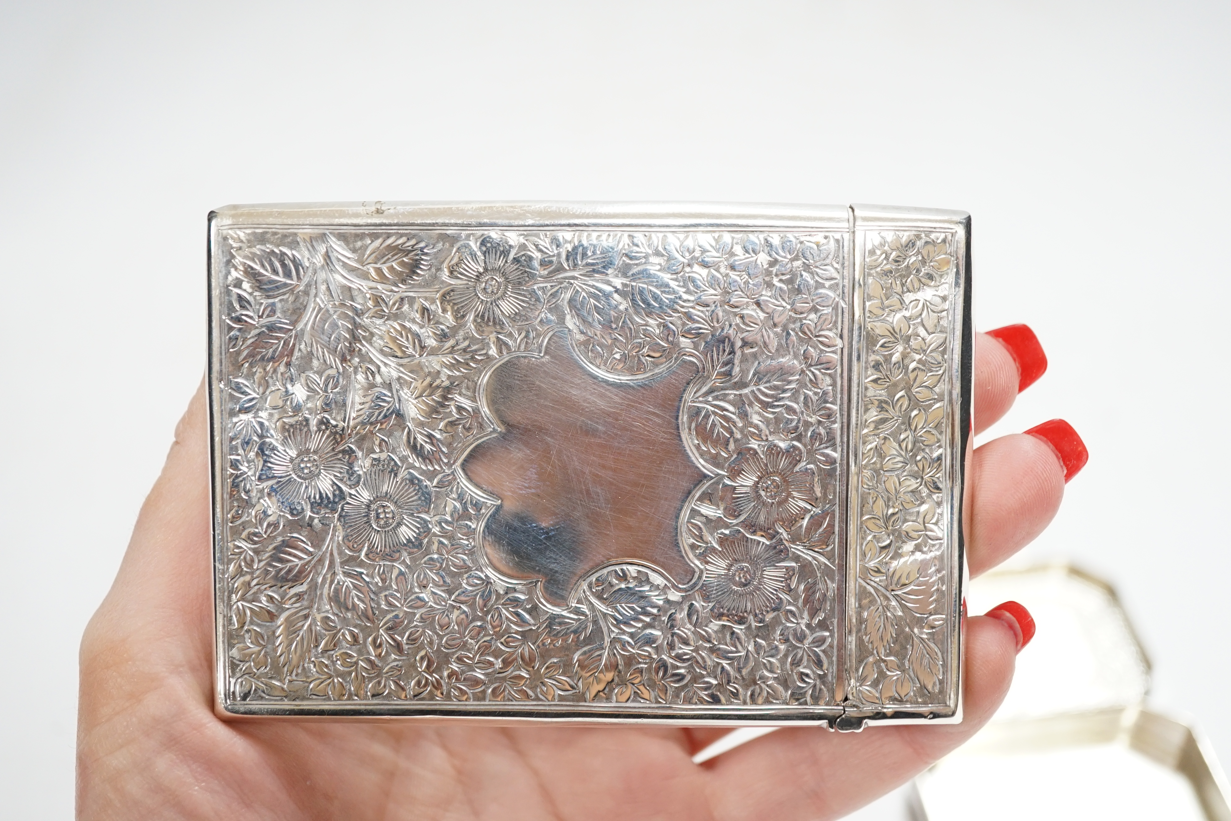 A late Victorian engraved silver rectangular card case, George Unite, Birmingham, 1895, 99mm, together with a modern silver pill box.